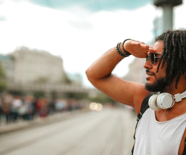 Man feeling energetic and strong in an urban environment.